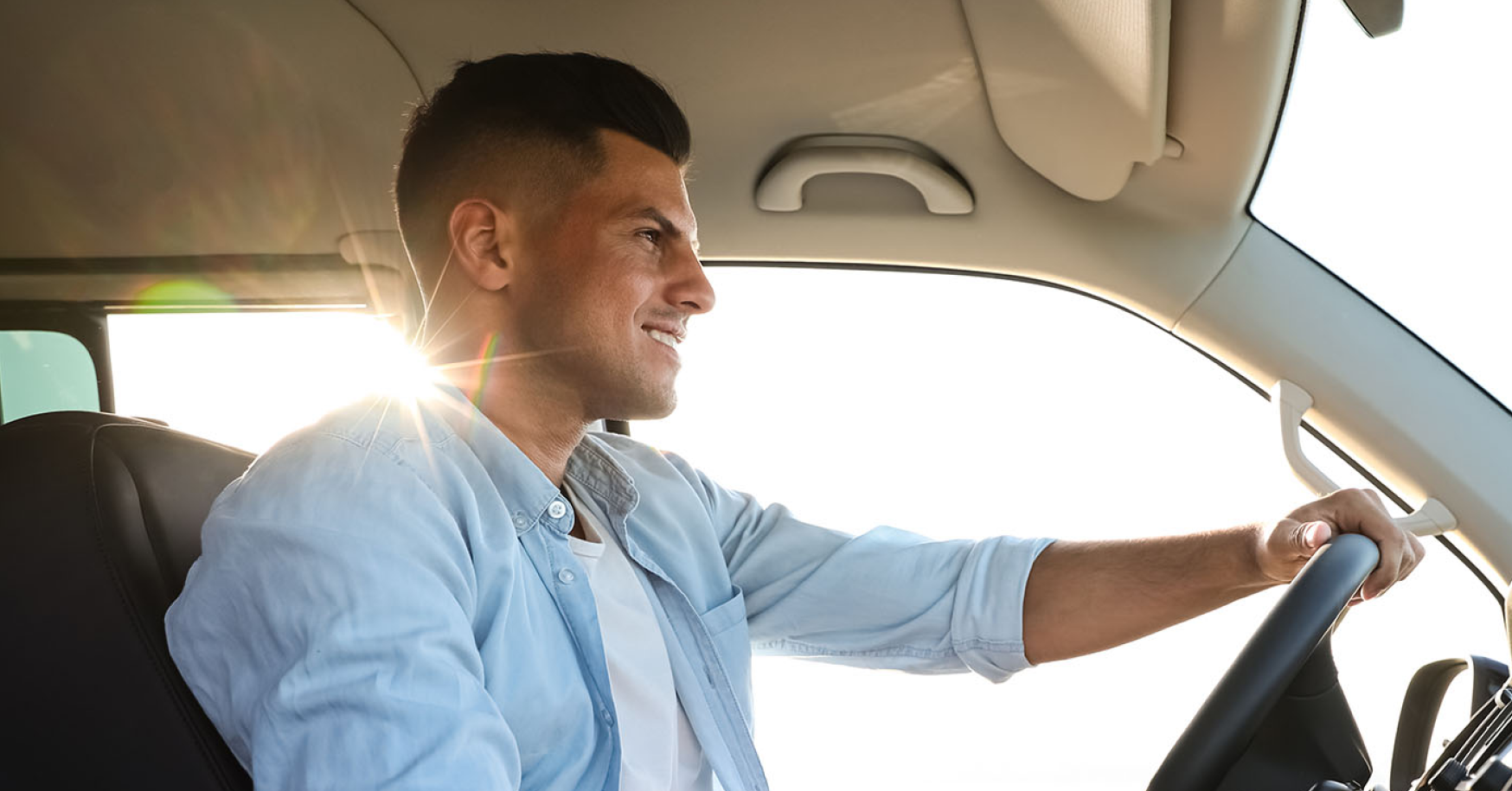 Man behind wheel of car