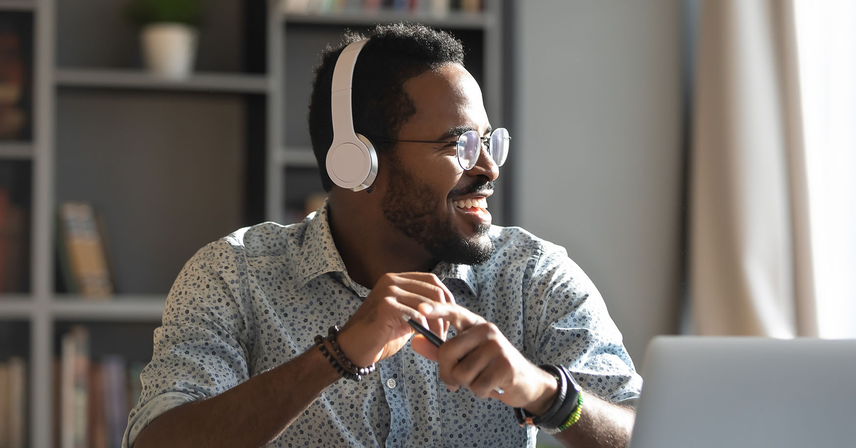 Man smiling listening to headphones