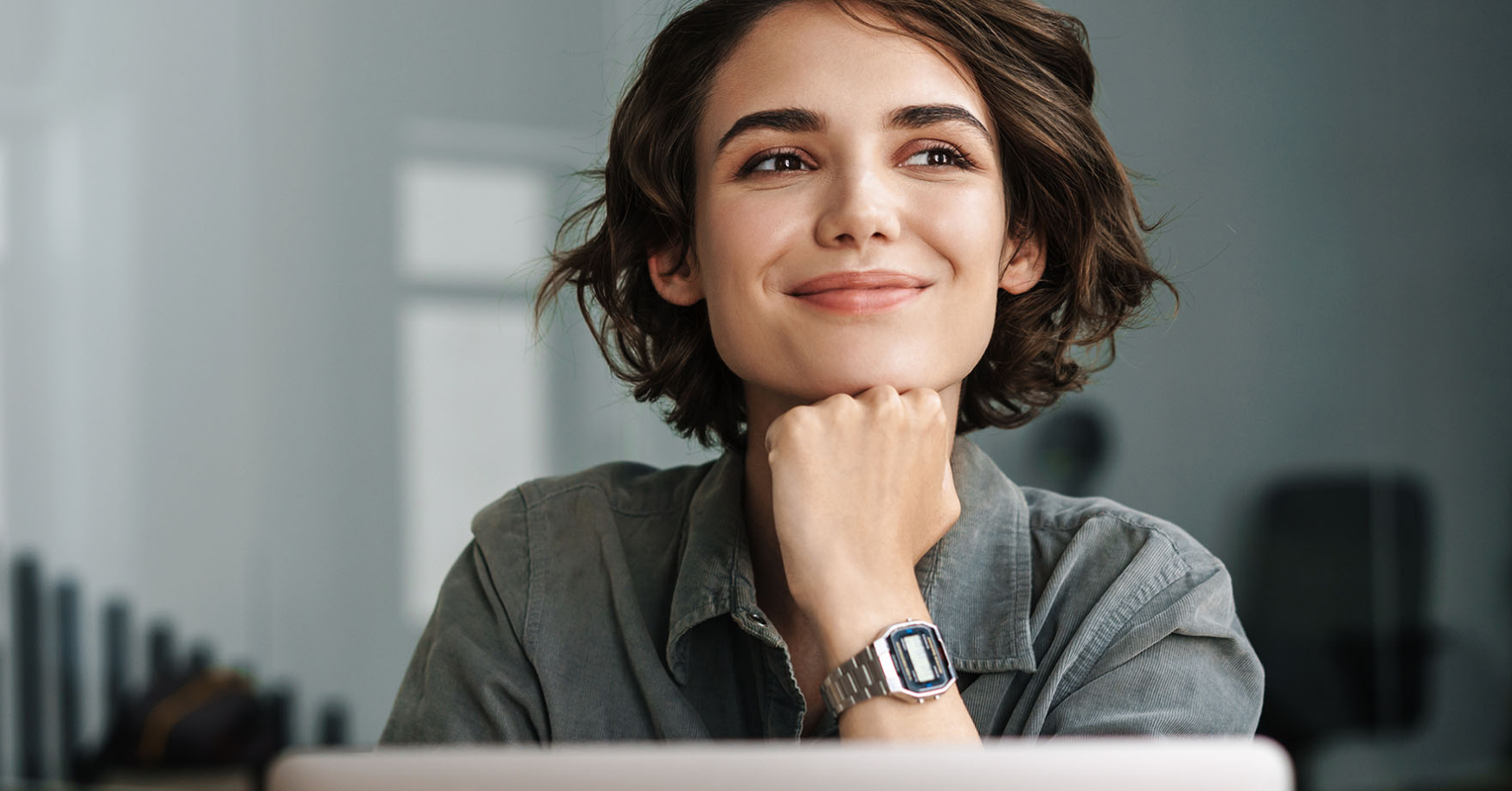 woman sitting at computer smiling