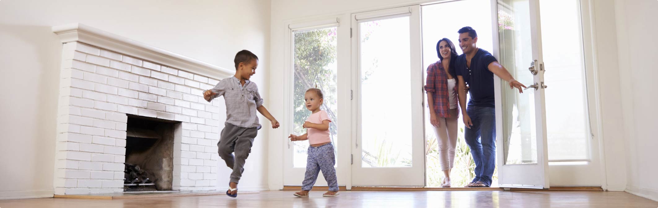 Happy Family Running Into a New Home